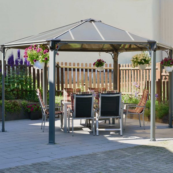paved patio with gazebo covering an alfresco dining area