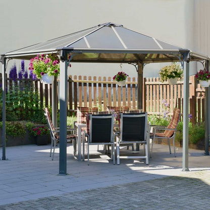 paved patio with gazebo covering an alfresco dining area