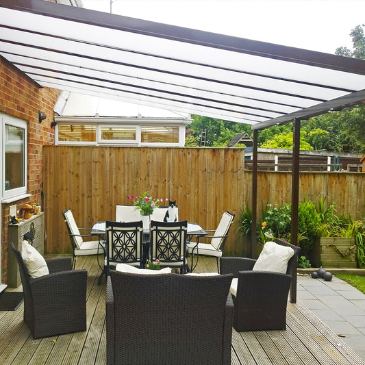 brown harmony patio canopy covering a decking area with outdoor furniture underneath