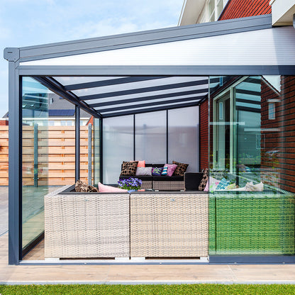 Modern patio canopy with outdoor furniture underneath on a sunny day.